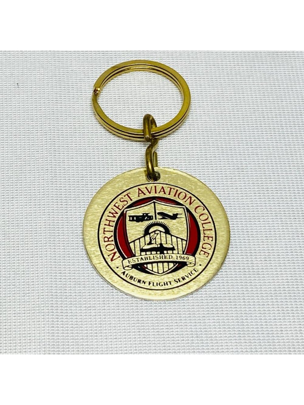 Northwest Aviation College Gold Keychain With Auburn Flight Service Logo